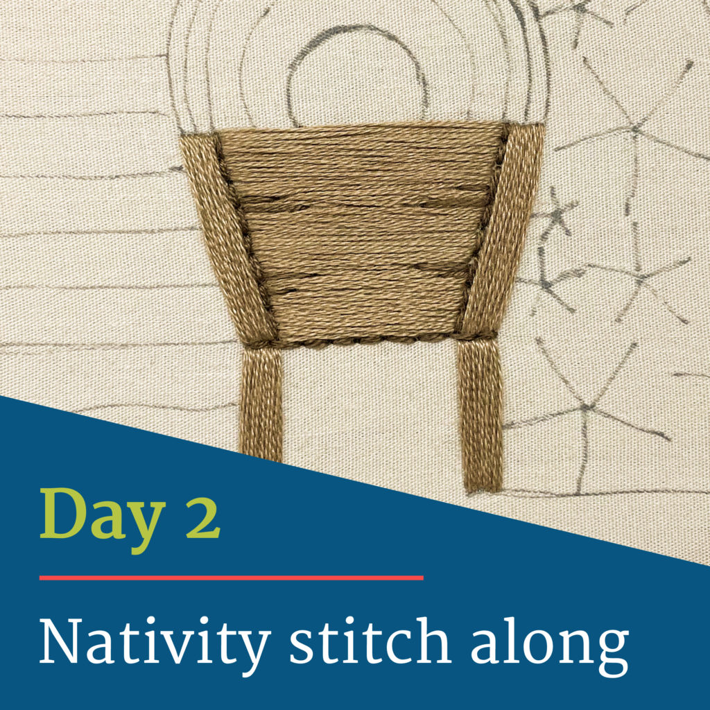 Test reads "Day 2, Nativity stitch along." Image shows the manger stitched.