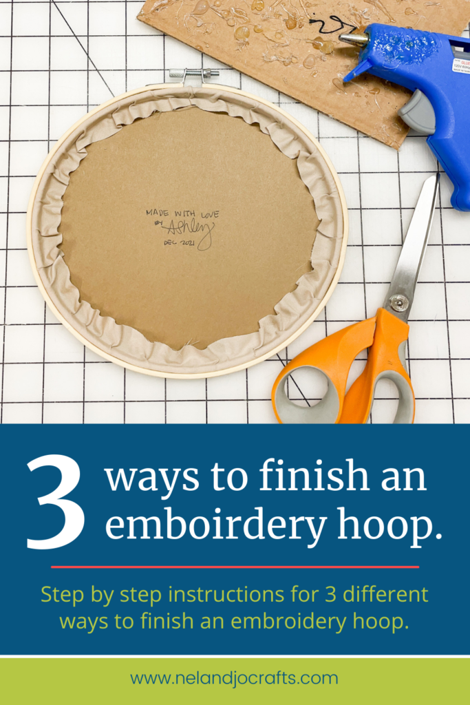 Image show the finished back of an embroidery hoop with craft paper cover the back. Test reads "3 ways to finish an embroidery hoop."
