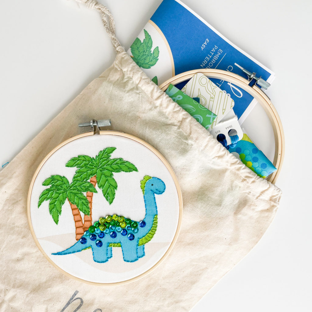 Image of Danny Dinosaur kit with all the supplies show inside the project bag.