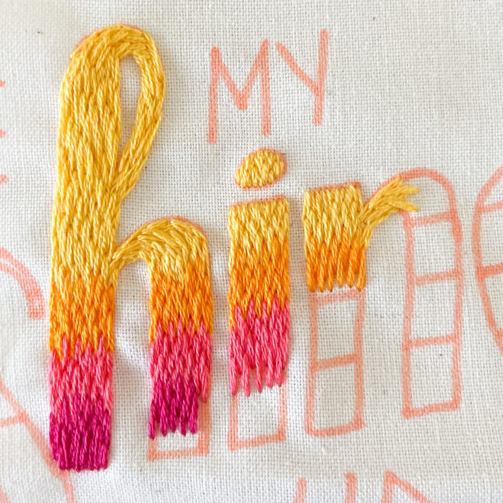 The letters "hin" partially filled with long and short stitch. The best fill stitch for blending colors in thick lettering.