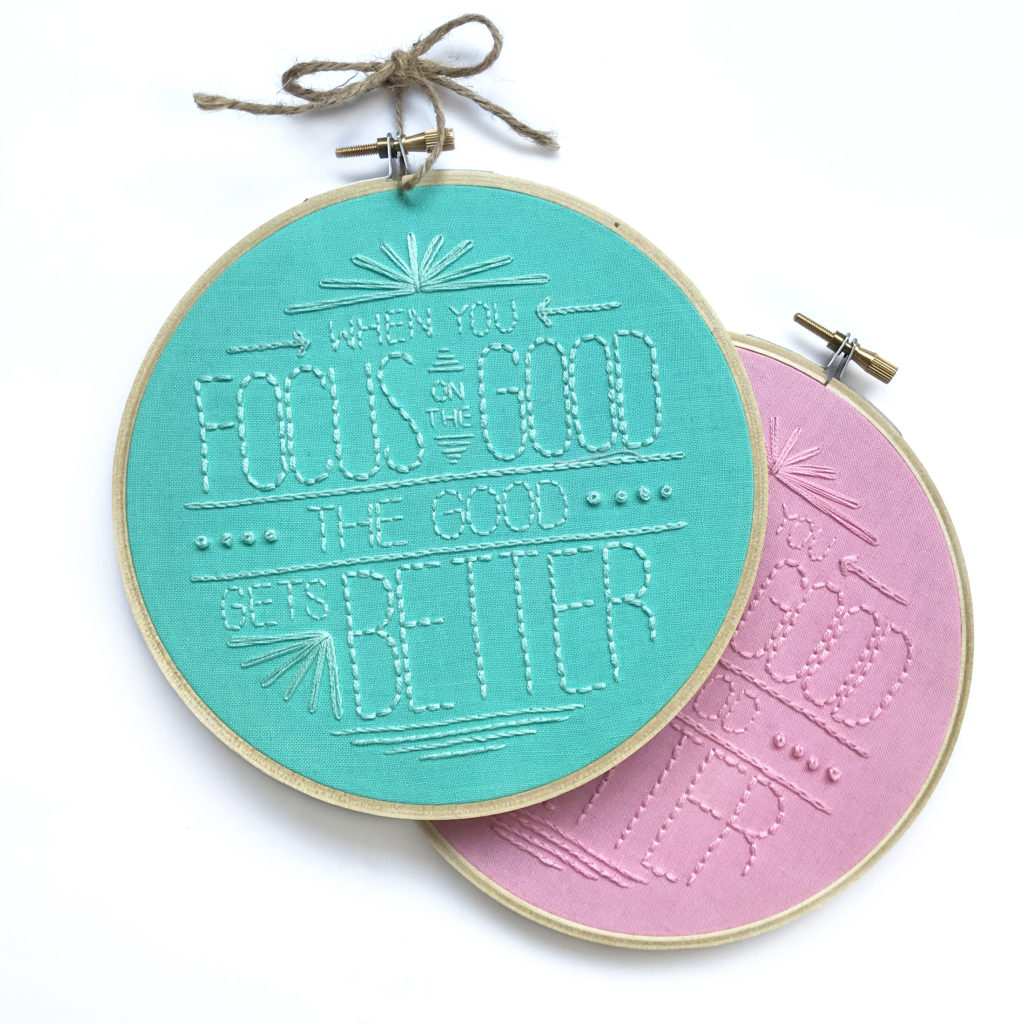 Image of the quote 'When you focus on the good, the good get's better" stitched on two hoops.
